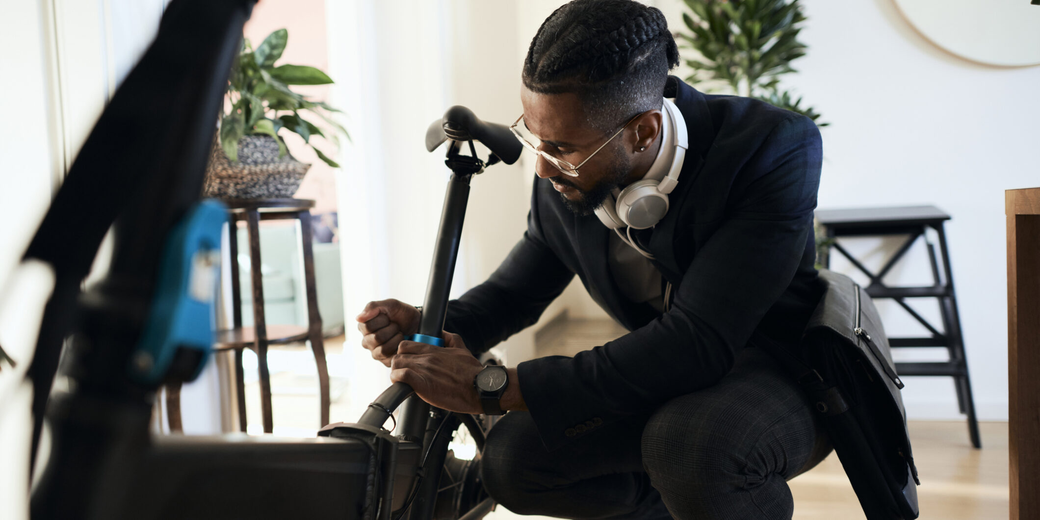 Young businessman in business casual outfit , use electric bike for mode of transport