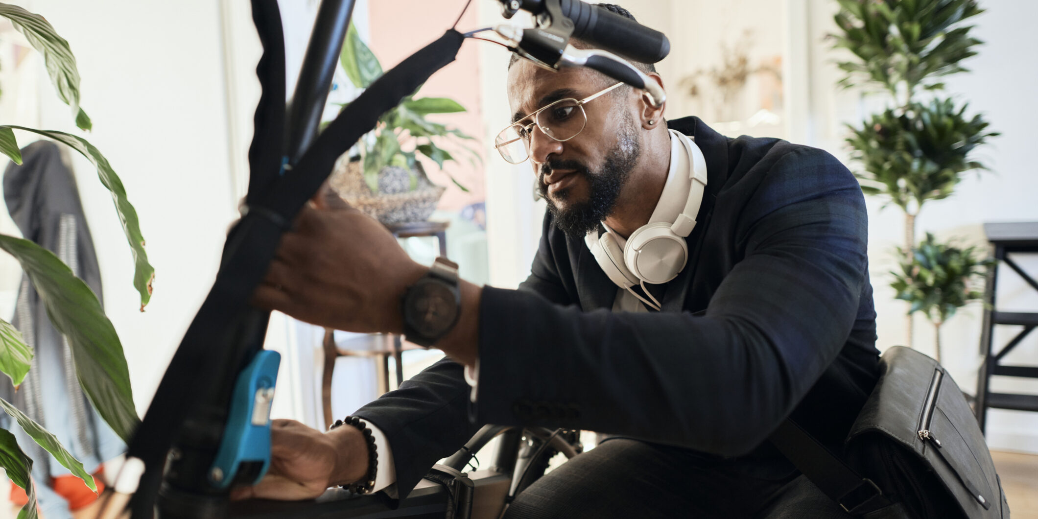 Young businessman in business casual outfit , use electric bike for mode of transport