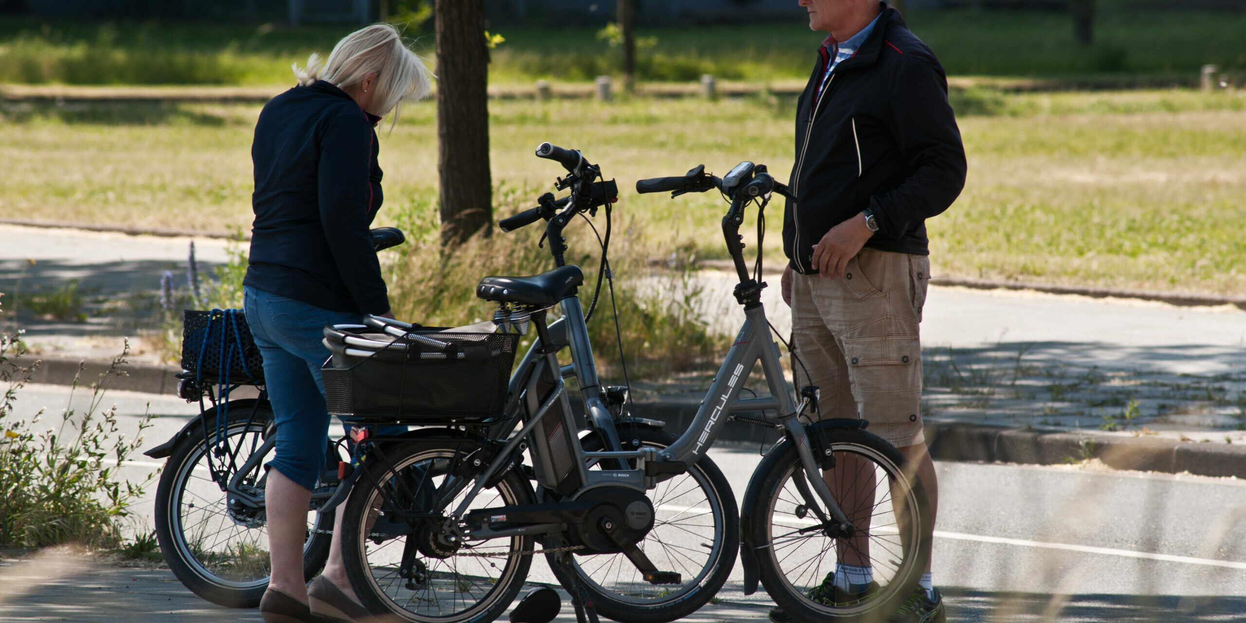 Elderly Couple Cyclists Prepare Their Hercules Branded Electric Bicycles In Phoenix See Hoerde – Dortmund, Germany