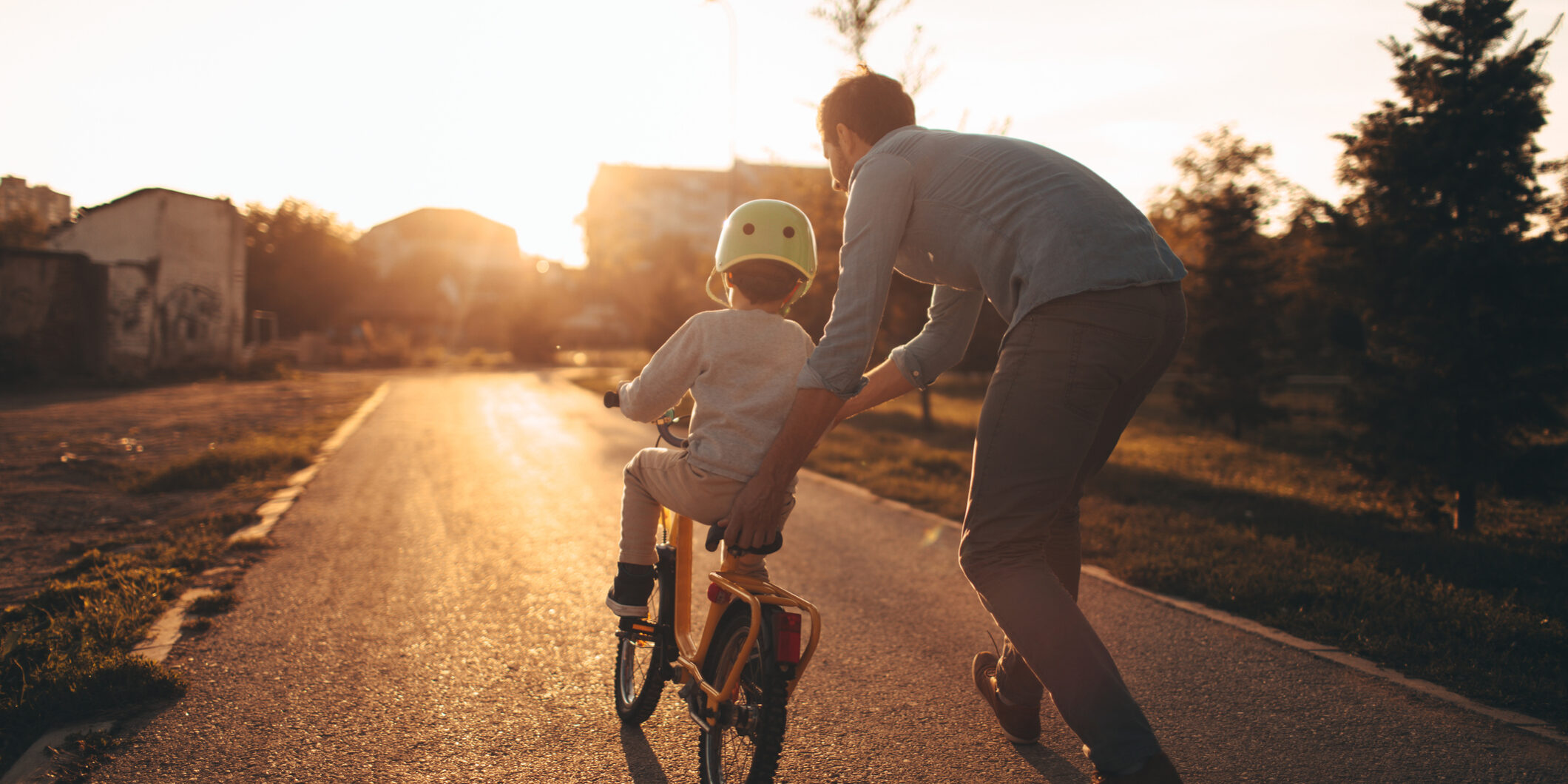 Father and son on a bicycle lane