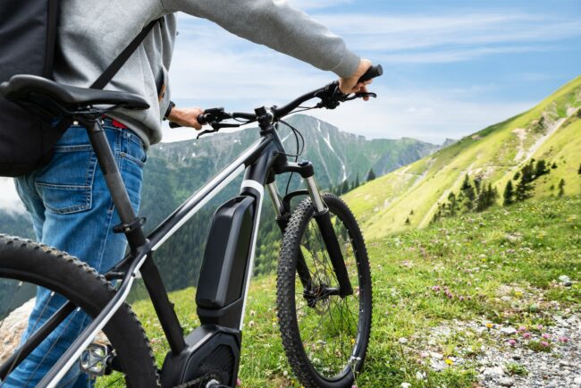 Main On Mountain With His Bike