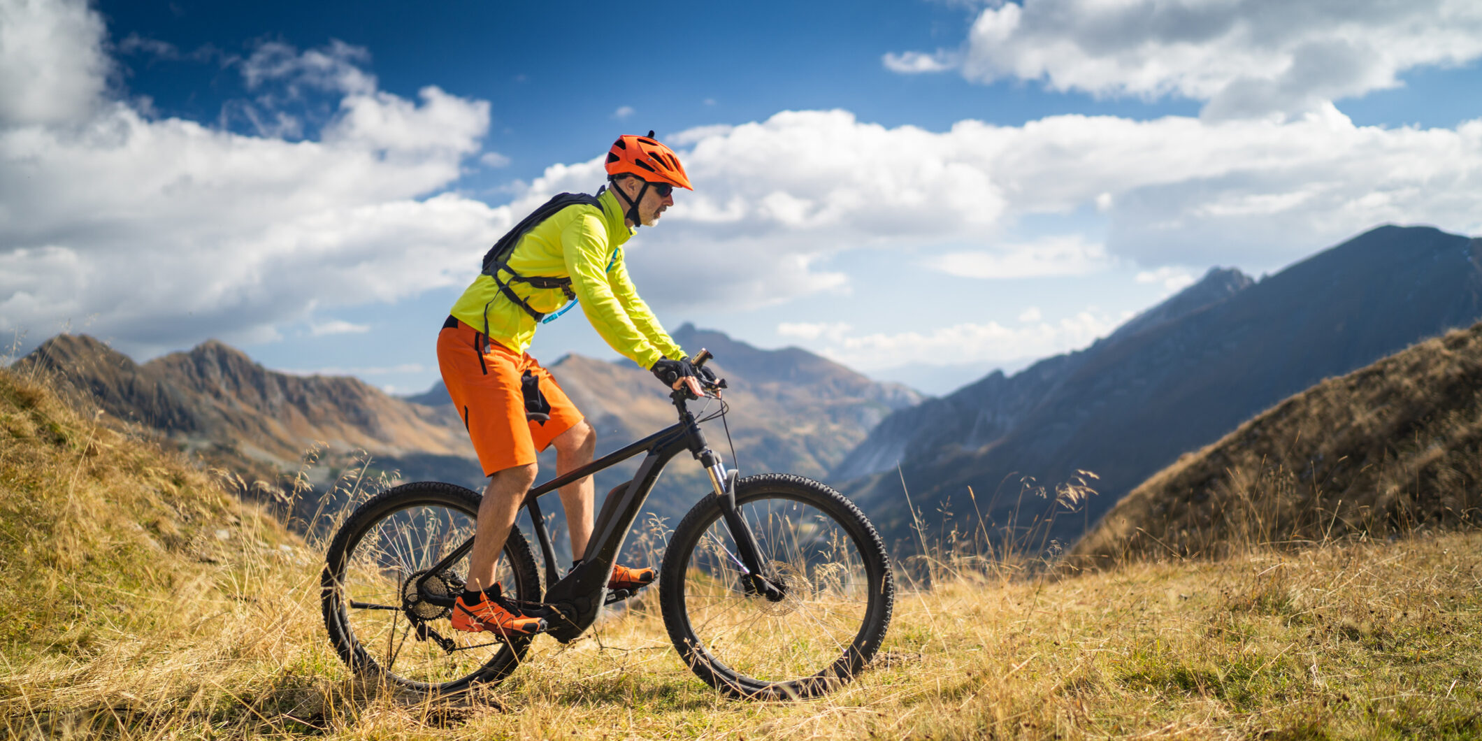 one mountain biker high up in european alps
