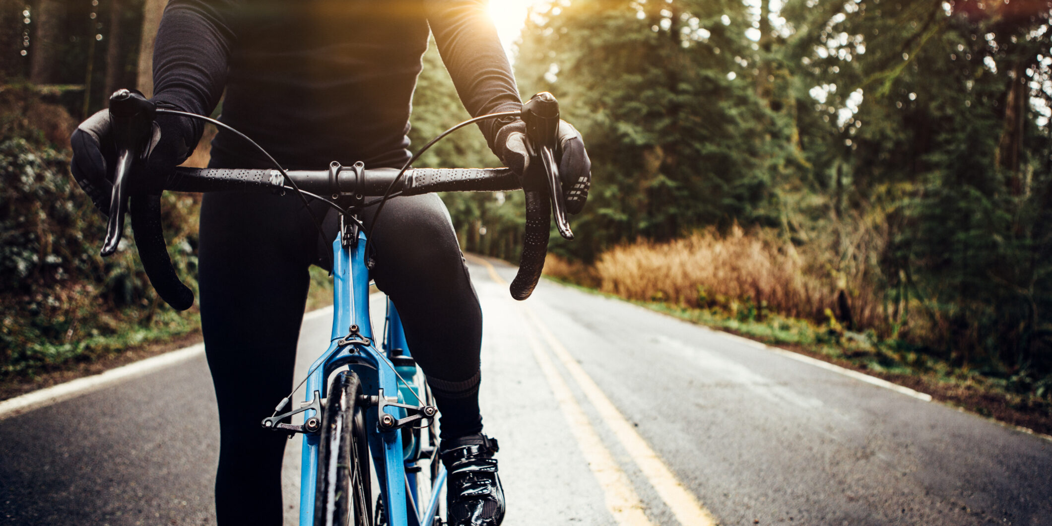 Cyclist Riding Mountain Road on Racing Bike